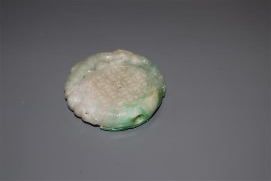 A carved jade plaque, diameter 5cm